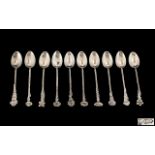 Italian Mid 20th Century Fine Set of Ten Silver Teaspoons Each with Flower Tops and Sinuous Stems.