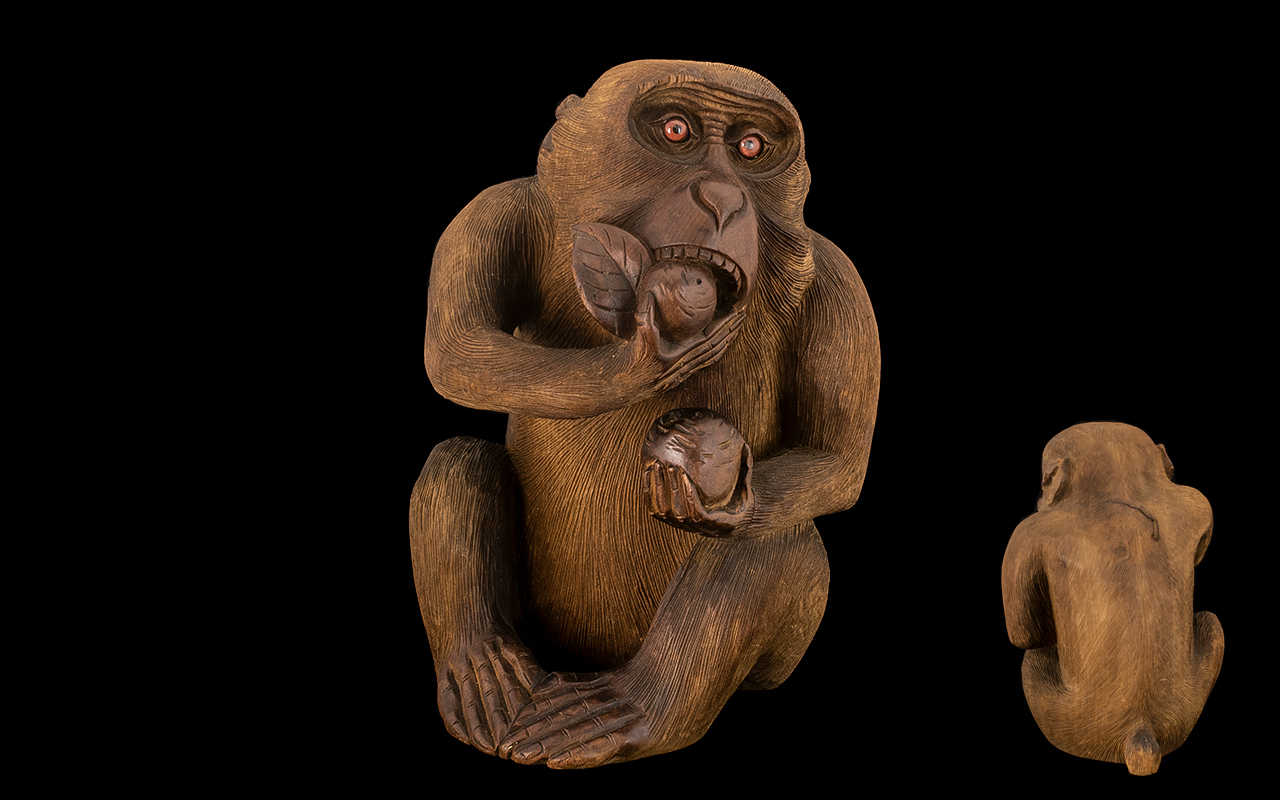 Japanese Meiji Period Carving of a Monkey Eating a Peach, of unusually large size, with finely