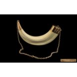 1930s Gold Mounted Boar's Tusk stamped 'Made in Kenya'; 9ct gold with attached chain; tusk size 4.
