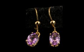 Amethyst Solitaire Drop Earrings, The Oval Cut Amethysts Totalling 2.