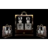 Two Bottled Reproduction Tantalus with mahogany frame,