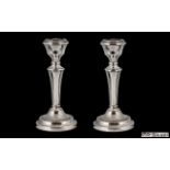 Elizabeth II Pair of Silver Candlesticks, Supported on Reeded Circular Bases with Tapered Stem.
