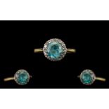 Antique 18ct Gold And Platinum Ring Central Blue Zircon Surrounded By Round Cut Diamonds.