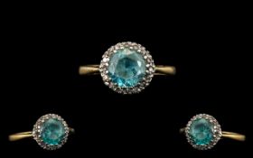 Antique 18ct Gold And Platinum Ring Central Blue Zircon Surrounded By Round Cut Diamonds.