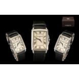 A Raymond Weil Rectangular Wristwatch, cream dial, Roman Numerals with date aperture.