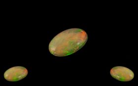 Ethiopian Natural Orange Fire Oval Shaped Opal. Wonderful Colours. Measurements 15.6 x 9.3 x 4.3 mm.