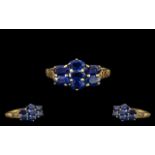 9ct Gold Dress Ring set with oval cut blue stones, fully hallmarked.