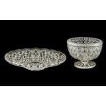 Two Large Glass Dishes - a heavy footed Fruit Bowl measuring 9" wide and 7" tall,