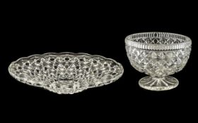 Two Large Glass Dishes - a heavy footed Fruit Bowl measuring 9" wide and 7" tall,