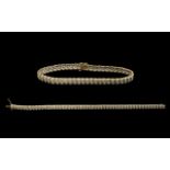 9ct Gold Diamond Bracelet each link set with a round cut diamond. Fully hallmarked. Length 7.