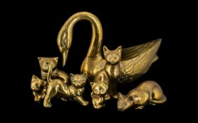Collection of Brass Items including a 10" tall swan; and six various sized brass cats.