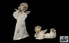 Two Lladro Figures comprising an angel measuring 9" tall,