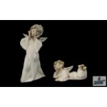 Two Lladro Figures comprising an angel measuring 9" tall,