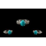 Sleeping Beauty Turquoise and White Zircon Ring, an oval cut cabochon of over 2cts of the bright,