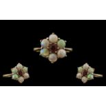 Ladies 9ct Gold Opal and Garnet Set Dress Ring, Flower head Setting. Fully Hallmarked for 9.375.