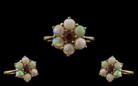 Ladies 9ct Gold Opal and Garnet Set Dress Ring, Flower head Setting. Fully Hallmarked for 9.375.