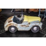 An Austin J40 Vintage Pedal Car circa 1950, painted blue with blue padded seat,