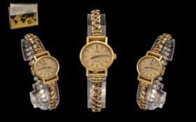 Ladies Omega Wristwatch Gilt Striped Dial With Baton Numerals, Manual Wind.