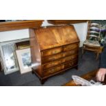 A Georgian Style Mahogany Bureau the fall front with green tooled leather top,