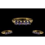 9ct Gold Ladies Dress Ring with Tanzanite. Ring size S. Attractive ring with five Tanzanites.