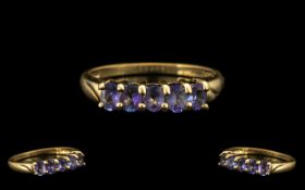 9ct Gold Ladies Dress Ring with Tanzanite. Ring size S. Attractive ring with five Tanzanites.