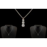 18ct White Gold Superb Quality & Attractive Designed 3 Stone Diamond Set Drop Pendant.