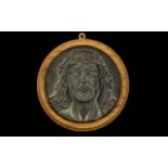 A Bronze Roundel Cast with the Head of Christ with thorns. 7 inches in diameter.
