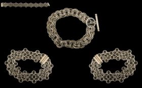 Three Sterling Silver Bracelets two in decorative chain link style,