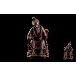 Antique Carved Chinese Cherry Wood Figure of an old man resting by the wayside,