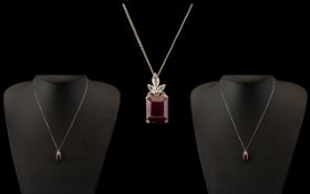 Ladies Sterling Silver Pendant & Chain, decorated with a central ruby red stone and crystals.