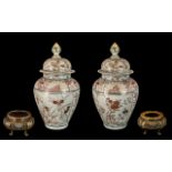 Pair of 18th Century Japanese Imari Lidded Vases of typical form and decoration,