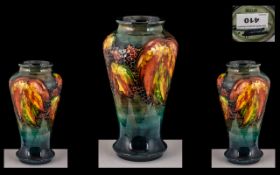 William Moorcroft Signed Flambe Fruits & Leaves Design Vase circa 1930s, of tapering form.