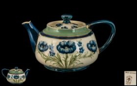 James Macintyre/ William Moorcroft Signed Teapot 'Blue Poppies' Design on white ground, circa 1910,