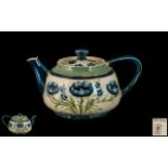 James Macintyre/ William Moorcroft Signed Teapot 'Blue Poppies' Design on white ground, circa 1910,