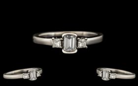 Contemporary Designed 18ct White Gold Diamond Set Ring. The emerald and princess cut diamonds of top