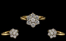 18ct Gold - Attractive Diamond Set Cluster Dress Ring. Flower head Setting. Marked 750 - 18ct.