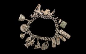 Sterling Silver Charm Bracelet Loaded with 14 Excellent Silver Charms.