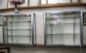 Chrome & Glass Display Cabinet with three moveable glass shelves and lighting,