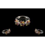 Rainbow Sapphire Floral Cluster Trilogy Ring, each flower set with green, golden yellow,