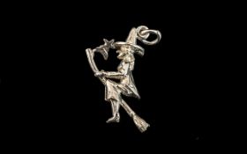 Silver Charm depicting a Witch on a broomstick with a small moon and star. Please see photograph.