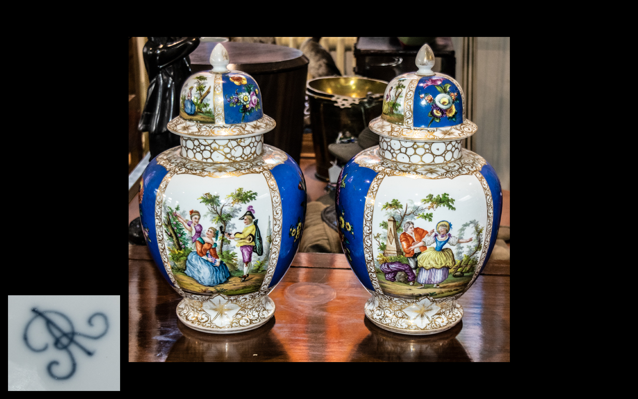 Pair of Ornate Ginger Jars, decorated in the Dresden style, with blue floral decoration.