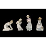 Four Lladro Figures to include a girl with slippers, cherub playing a violin,