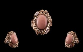 Pink Opal and Pink Sapphire Statement Ring, an oval cut cabochon of pink opal, measuring 7cts,