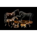 A Beswick Black Matt Beauty and Foal Connoisseur model surmounted on wooden base.