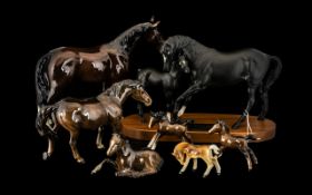 A Beswick Black Matt Beauty and Foal Connoisseur model surmounted on wooden base.