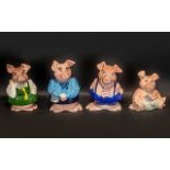 Collection of Four Wade Piggy Banks comprising Mummy Pig, Daddy Pig, School girl, and Baby Pig.