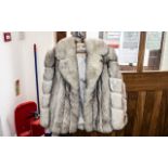 Ladies Silver Fox Fur Jacket, hip length, full length sleeves, two slit pockets.