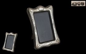 Elizabeth II Sterling Silver Photo Frame of Shaped Form. Makers Mark K.F. And Hallmark London 1985.