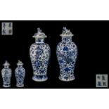 Two Small Antique Chinesee Blue and White Lidded Vases decorated to the body with dragons and