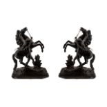 A Pair of Antique Spelter Marley Horses of black bronzed Patination on wood bases. Measuring 18